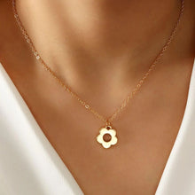 Load image into Gallery viewer, Gold look daisy pendant on chain necklace  worn by person
