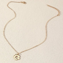 Load image into Gallery viewer, Gold look daisy pendant on chain necklace flat lay
