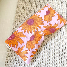 Load image into Gallery viewer, Pink, Purple and Yellow Sunflower design heat pack on neutral knitted fabric background
