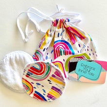 Load image into Gallery viewer, handmade breast pads in a bright rainbow fabric together with it&#39;s own travel/was tote
