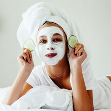 Load image into Gallery viewer, woman wearing clay face mask in a self care pamper session
