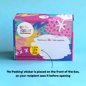 Hip Hooray Mail signature gift box with yellow no peeking until your birthday sticker placed on front