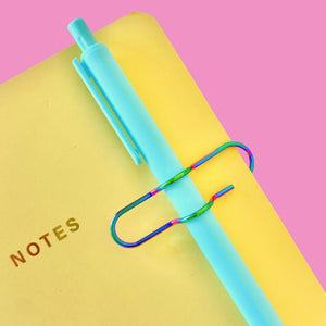 Yellow Notebook, with Blue Pen and Holographic Pen Clip