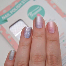 Load image into Gallery viewer, Mermaid themed nail wraps shown on nails and hand with a package in the background
