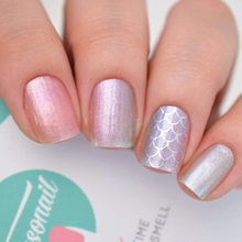 Load image into Gallery viewer, Mermaid themed nail wraps shown on nails and hand with a package in the background
