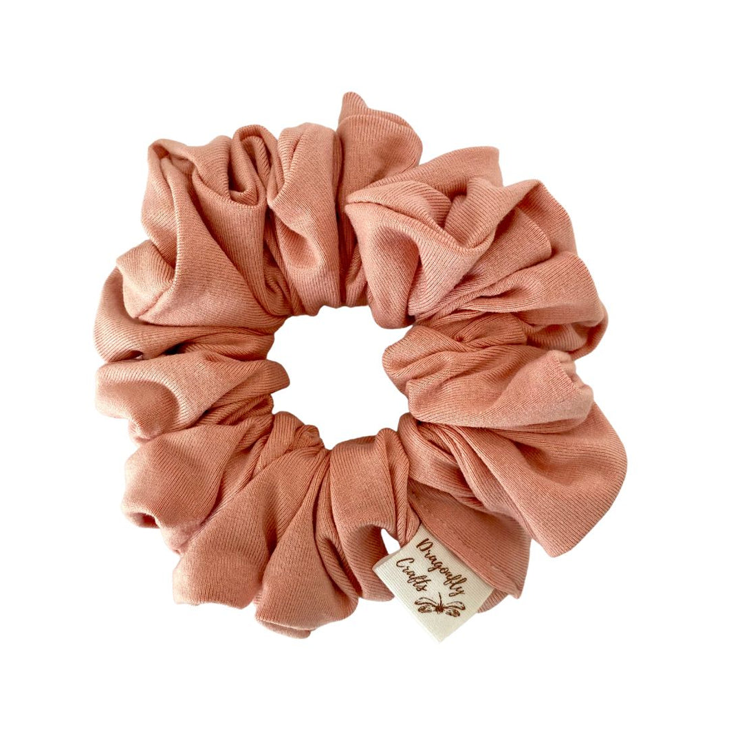 Pink srunchie made from Jersey Fabric on a white background