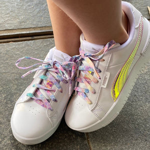 Handmaide shoelaces displayed on white puma sneakers