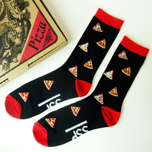 REd and black crew socks with pizza design flat layed next to a pizza box
